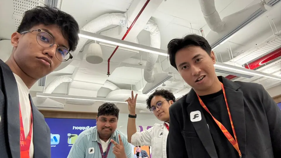 Selfie of the RideCheck team on demo day, under exposed ceiling ducts
